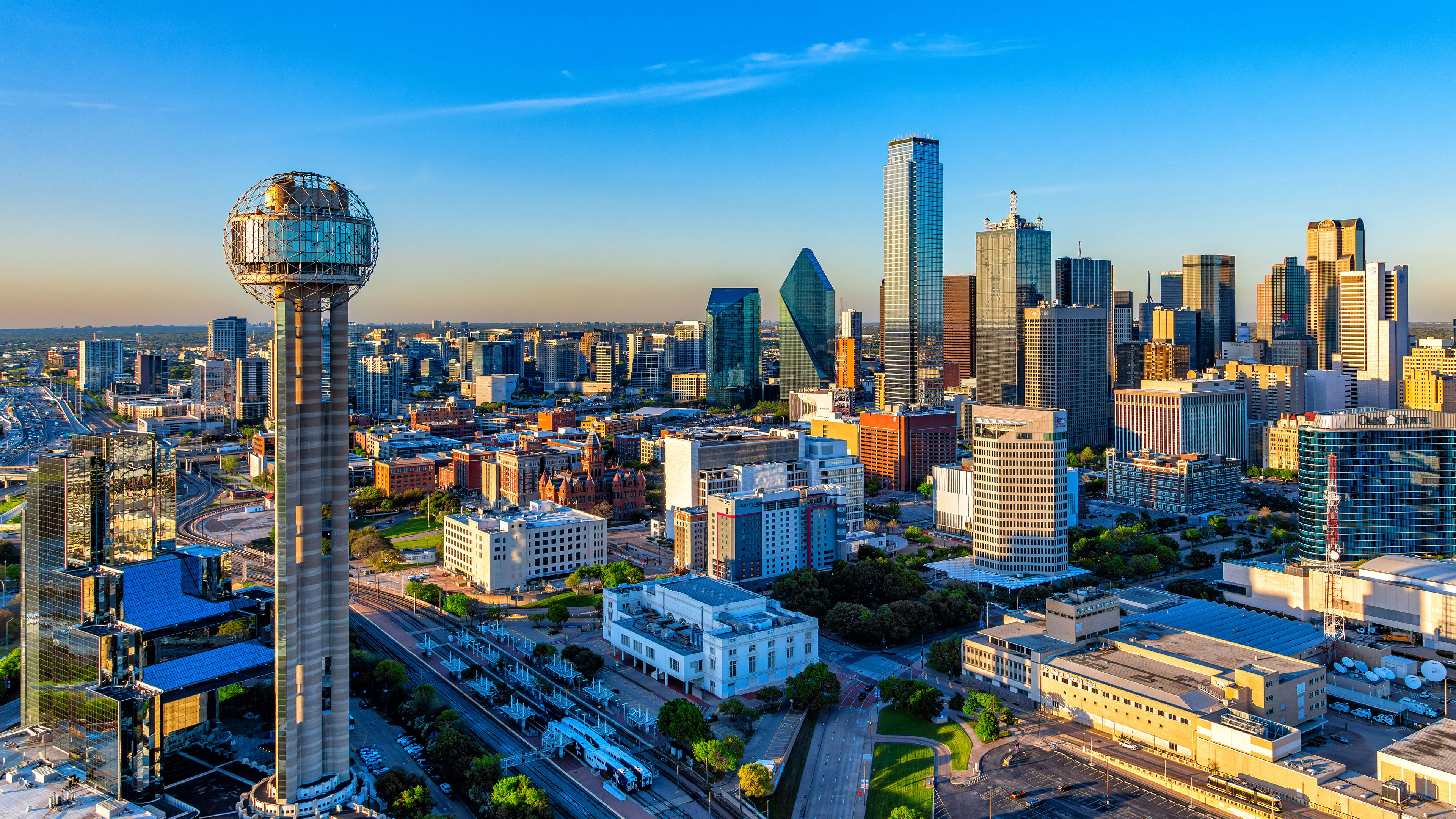 Dallas skyline with Reunion Tower, aerial view at golden hour
